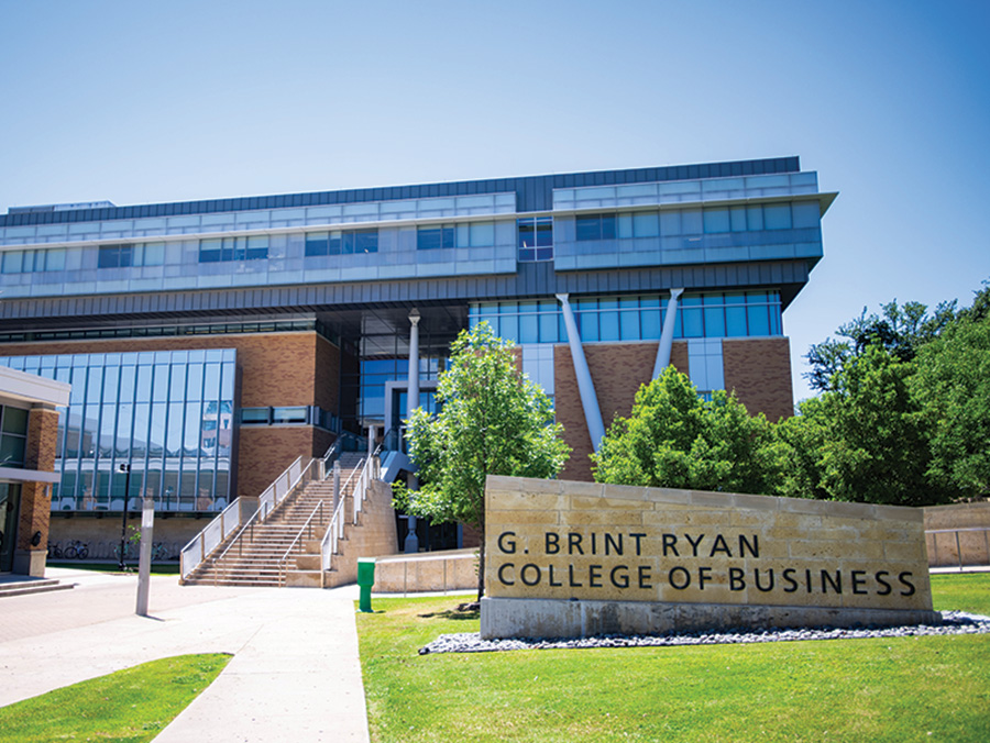 The G. Brint Ryan College of Business building and sign