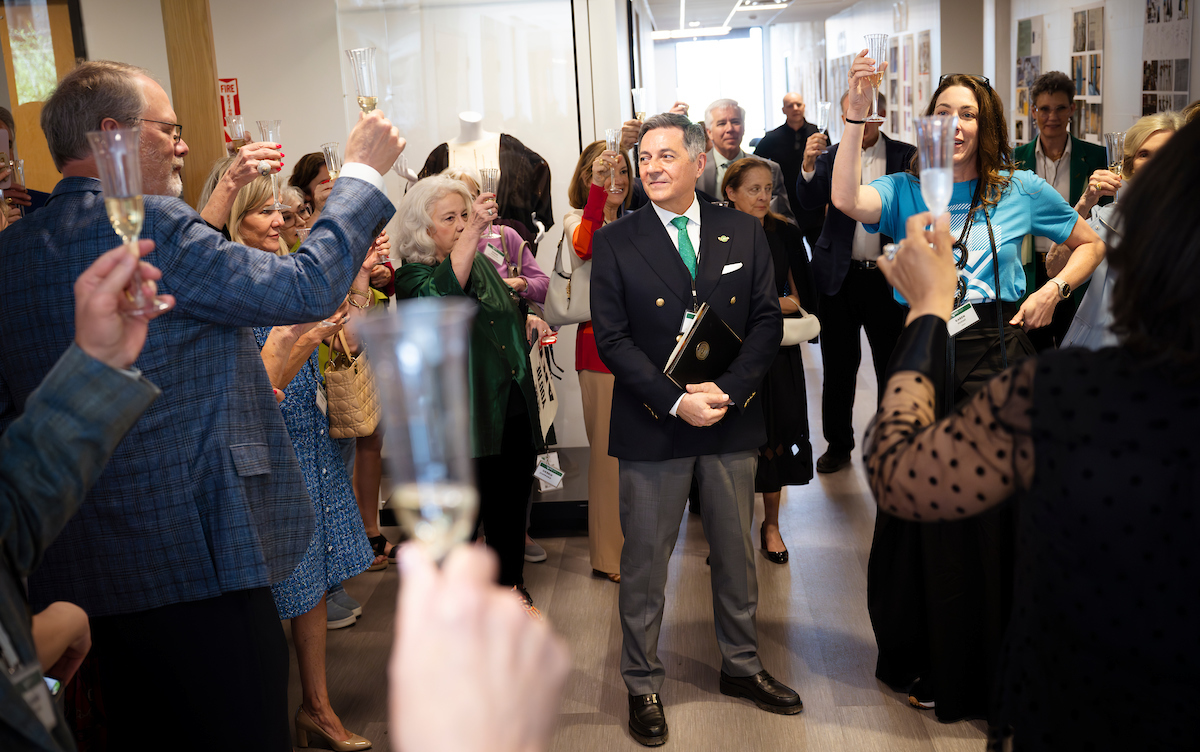 Attendees toast Michael Faircloth during the ceremony